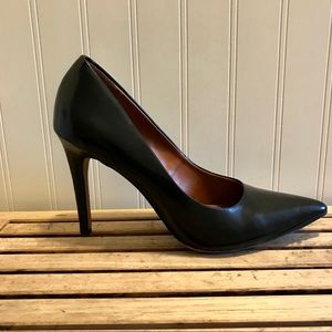 Black pointed toe pumps